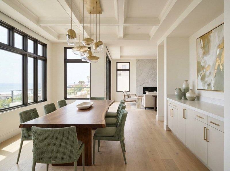 Dining room design concept with feature lighting and warm wood tones