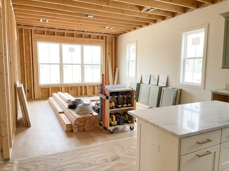 Organized remodeling jobsite with protected floors and tidy workspace — concept visualization